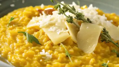 risotto-alla-Milanese- saffron-risotto-recipe- creamy-risotto-recipe- italian-risotto-dish- milan-style-risotto- risotto-alla-milanese-giallo-zafferano- how-to-make-risotto- risotto-with-saffron- arborio-rice-dish- golden-yellow-risotto- traditional-italian-rice-dish- slow-cooked-risotto- creamy-rice-with-cheese- luxurious-italian-dinner- parmesan-risotto- milan-risotto-recipe- holiday-side-dish- elegant-italian-meals- risotto-stirring-technique- comfort-food-rice-dish- risotto-for-beginner